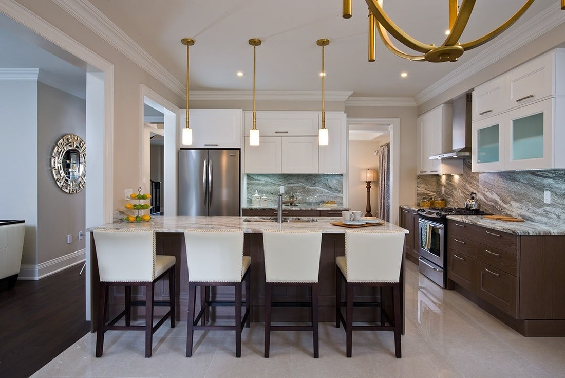 Stage kitchen display, sleek island with waterfall stone countertop fit 4 chairs, dark base cabinets and white uppers
